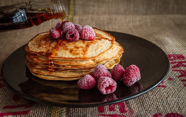 pancakes and berries with syrup